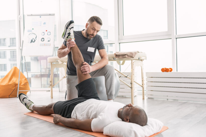 Physical therapist treating patient with herniated disc