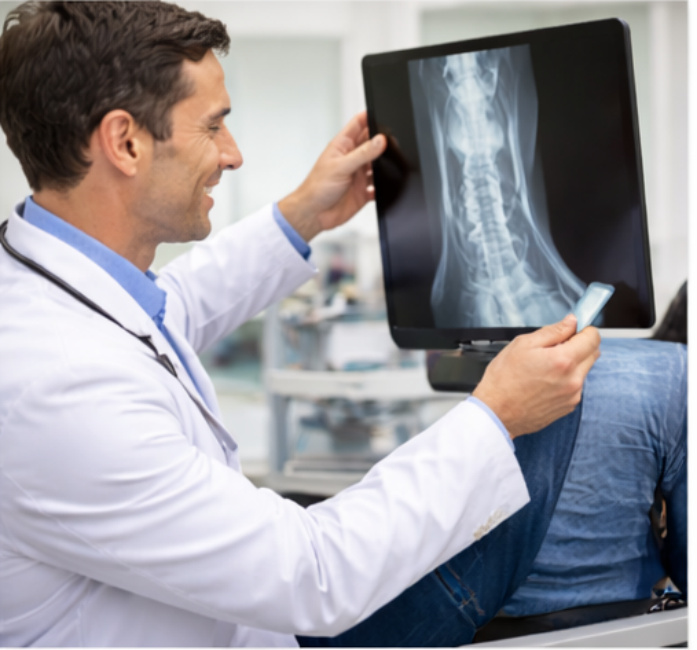 Doctor looking at an X-ray after an MCL Reconstruction. mcl reconstruction implant rehabilitation rehabilitation medial collateral ligament physiotherapy sutures physiotherapy medial collateral ligament physiotherapy suture physiotherapy surgical technique physiotherapy arthroscopy physiotherapy suture anchor medial collateral ligament arthroscopy anchor medial collateral ligament medial collateral ligaments medial collateral ligament physiotherapy mcl reconstruction anchor